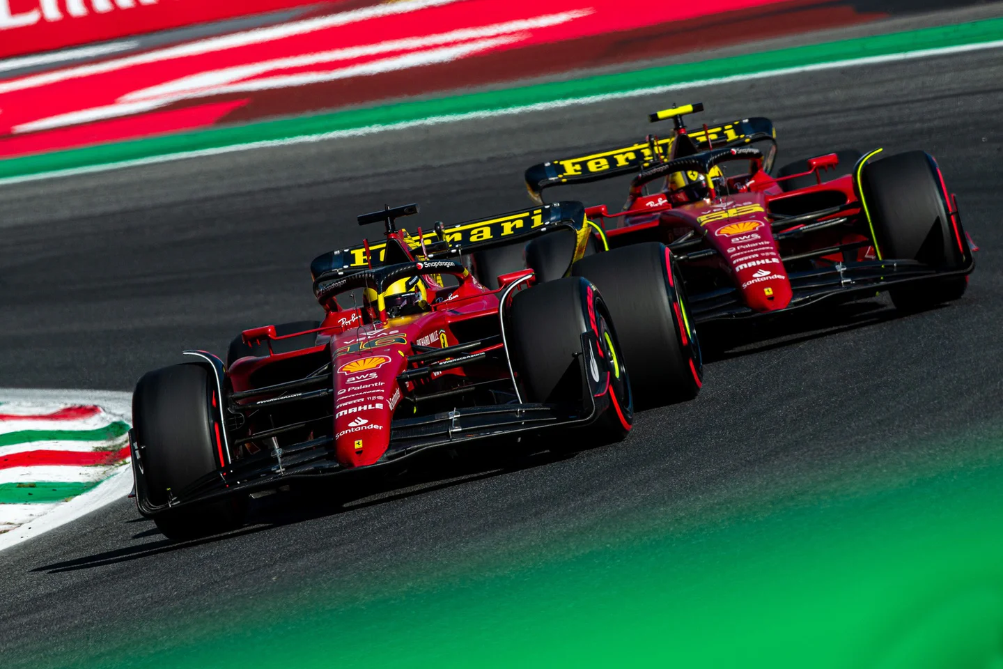Two Formula One cars racing on track