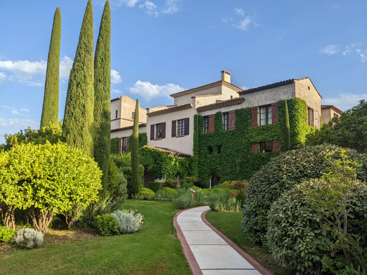 Ivy-covered luxury hotel with gardens