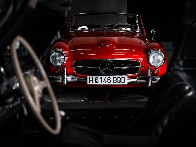 Classic sports car in a dark garage