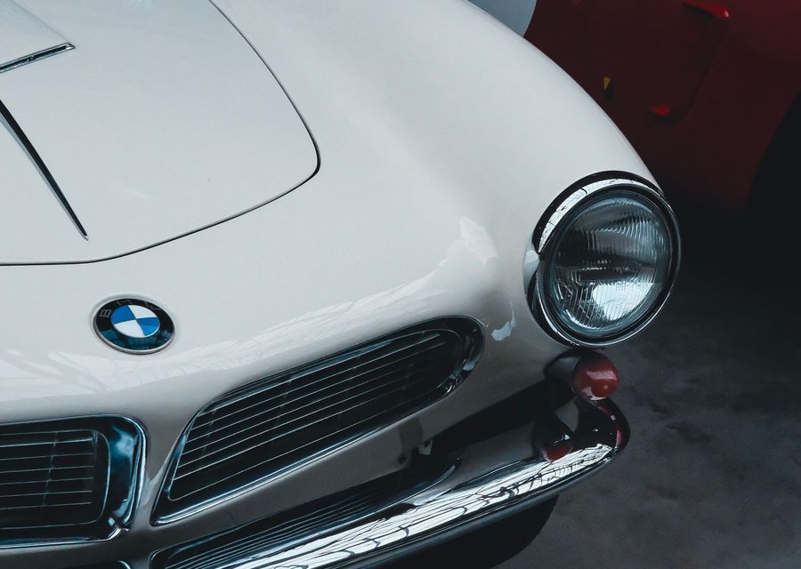 Classic BMW 507 and Ferrari in a private garage