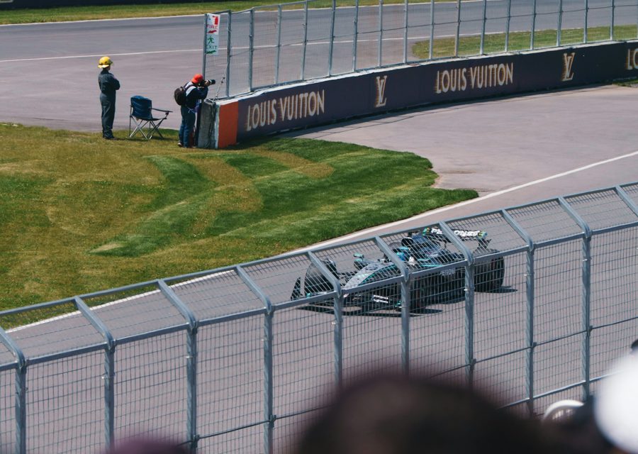 Formula 1 car at speed on circuit