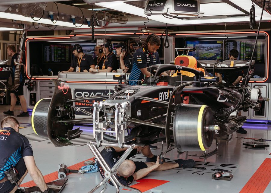 Formula 1 pit crew working on a racing car